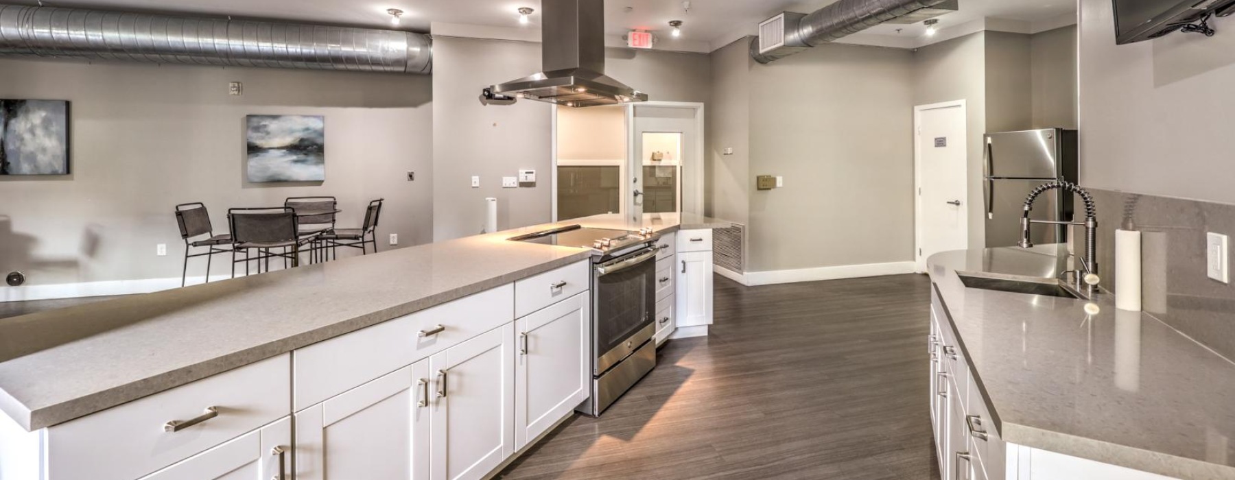 a kitchen with white cabinets