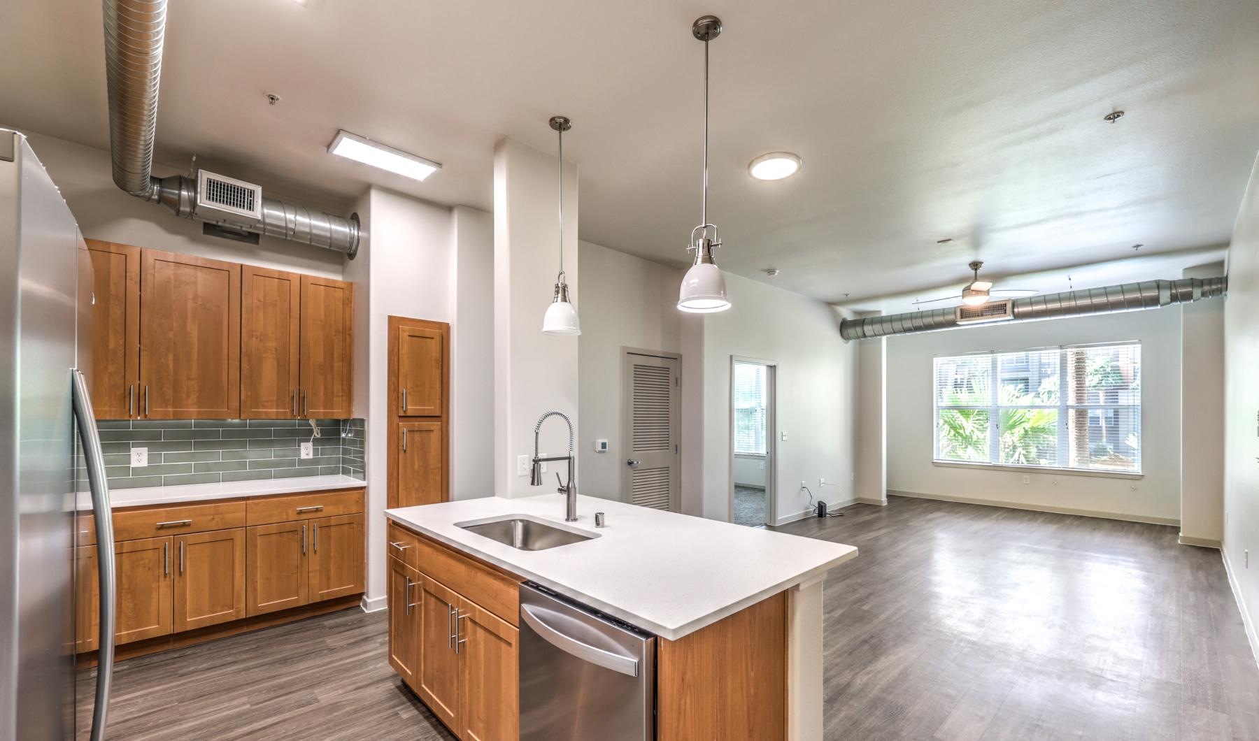 a kitchen with wooden cabinets